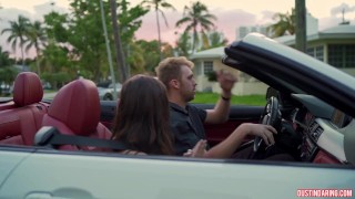 Busty slut gets fucked in BMW at the beach house